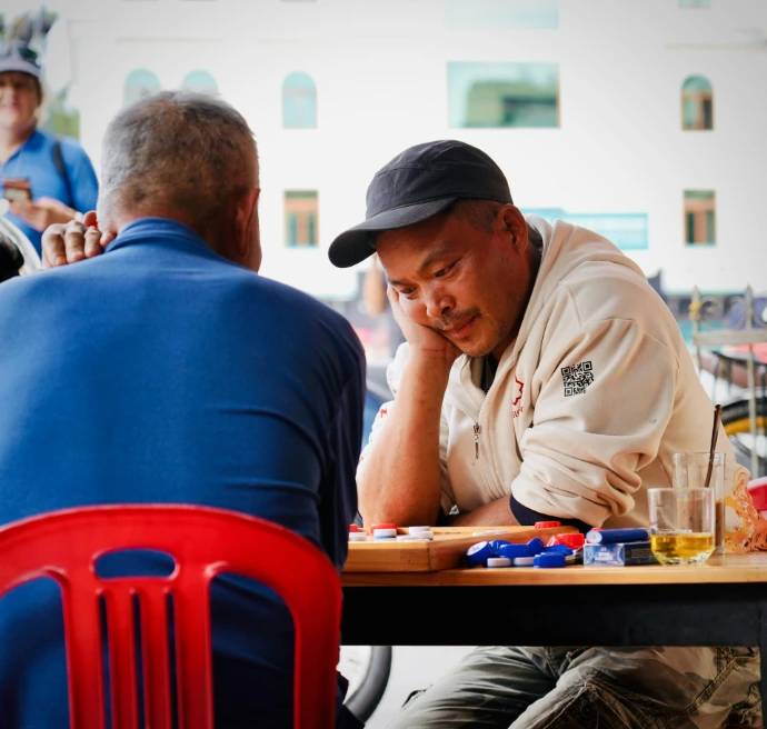 Two men playing a game at a table